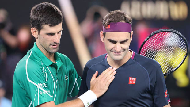 Novak Djokovic consoles Roger Federer