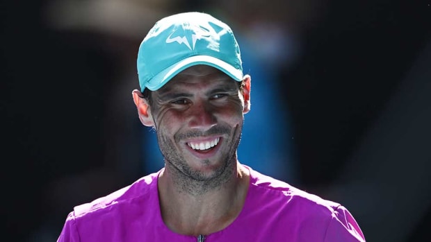 Rafael Nadal smiles on court