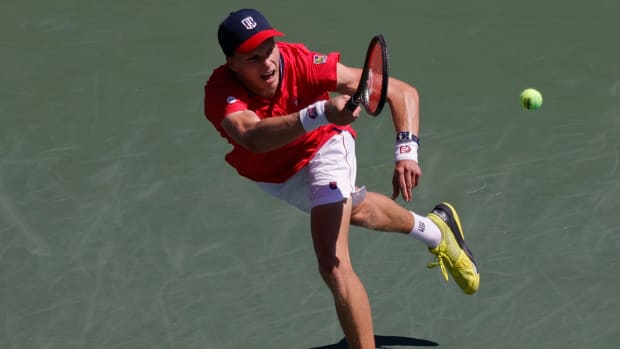 Jenson Brooksby in US Open action against Borna Coric