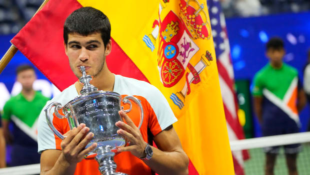 Carlos Alcaraz with US Open title after historic final win