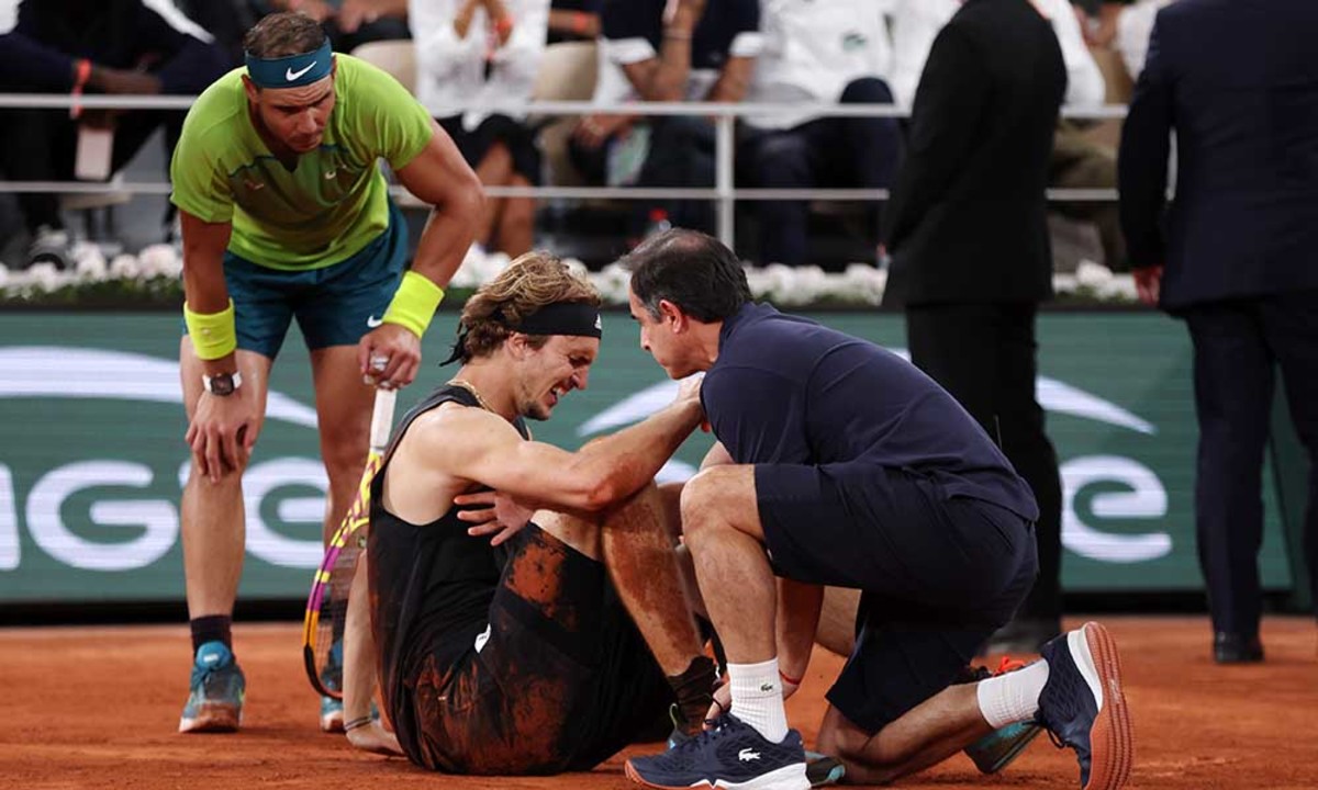 Rafael Nadal checks on Alexander Zverev after injury