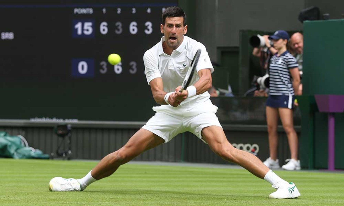 Novak Djokovic sliding on grass at Wimbledon