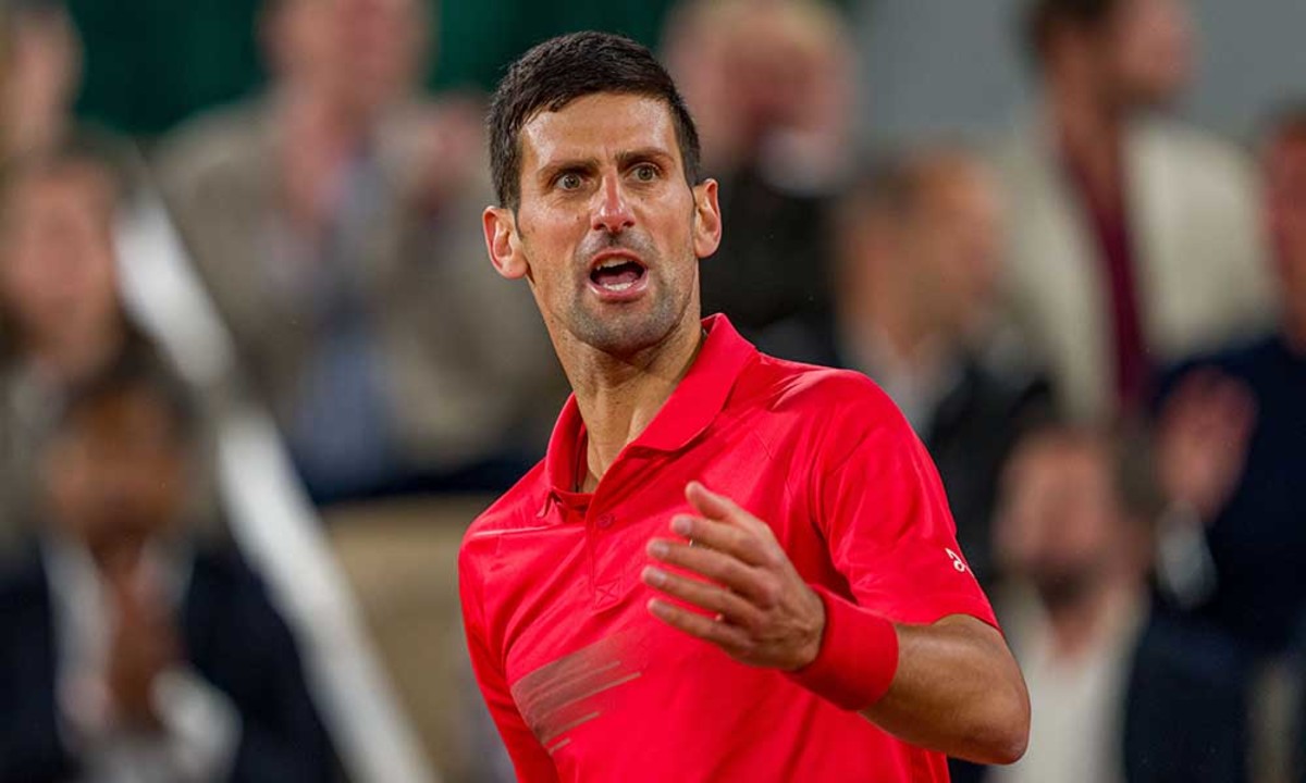 Novak Djokovic reacts to Rafael Nadal point