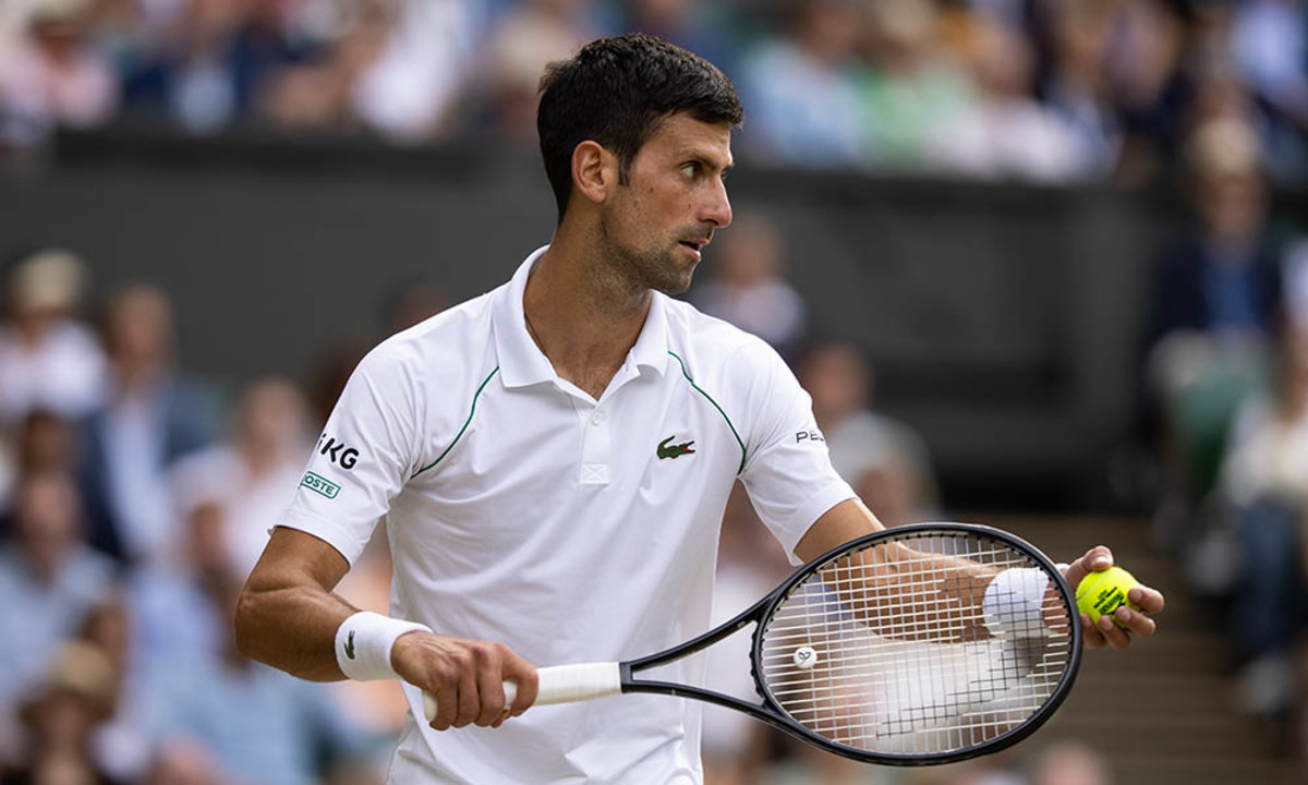Novak Djokovic about to serve at Wimbledon