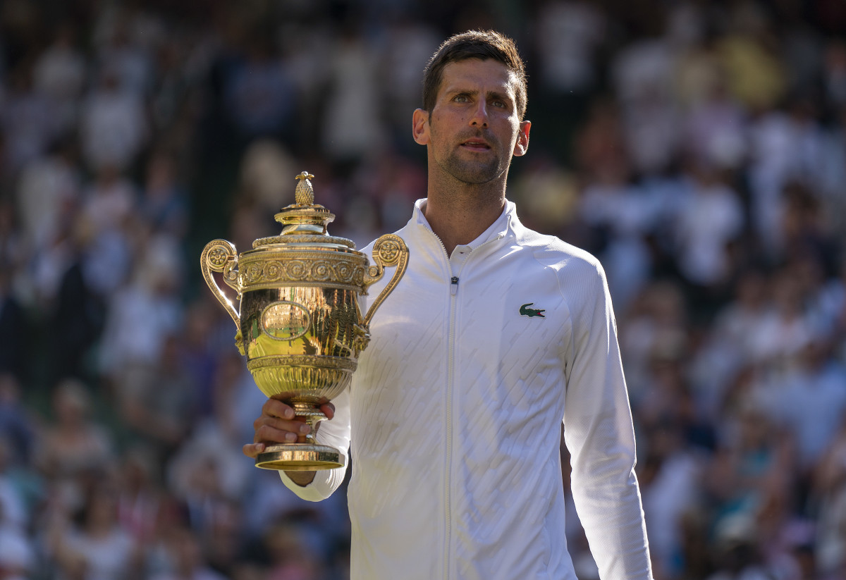 Novak Djokovic with the Wimbledon trophy 2022
