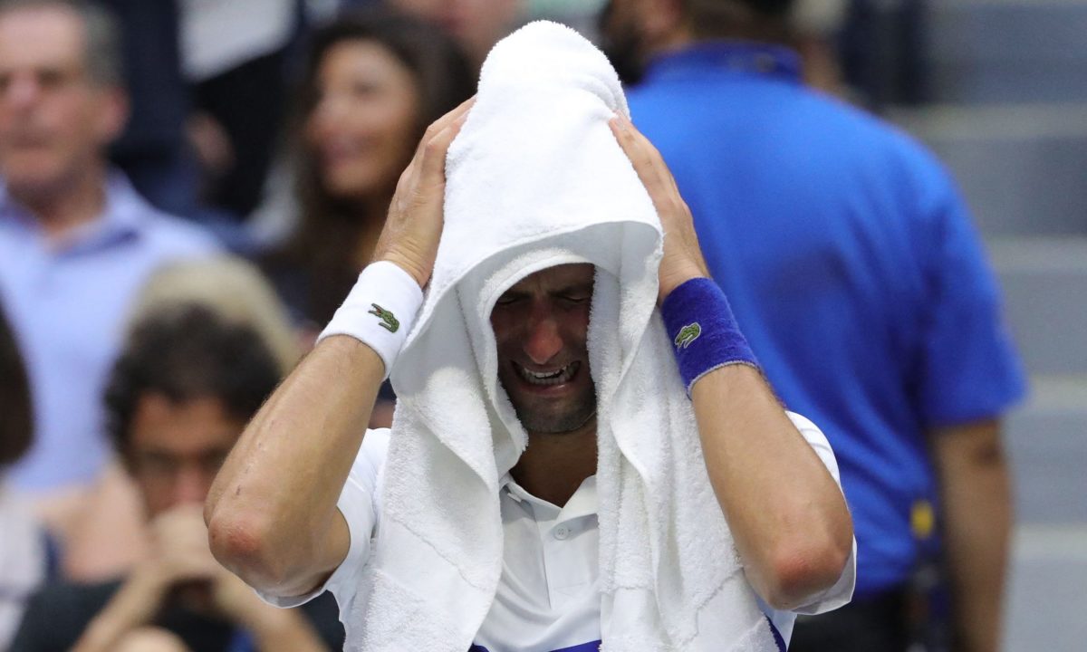 Novak Djokovic crying under towel at US Open
